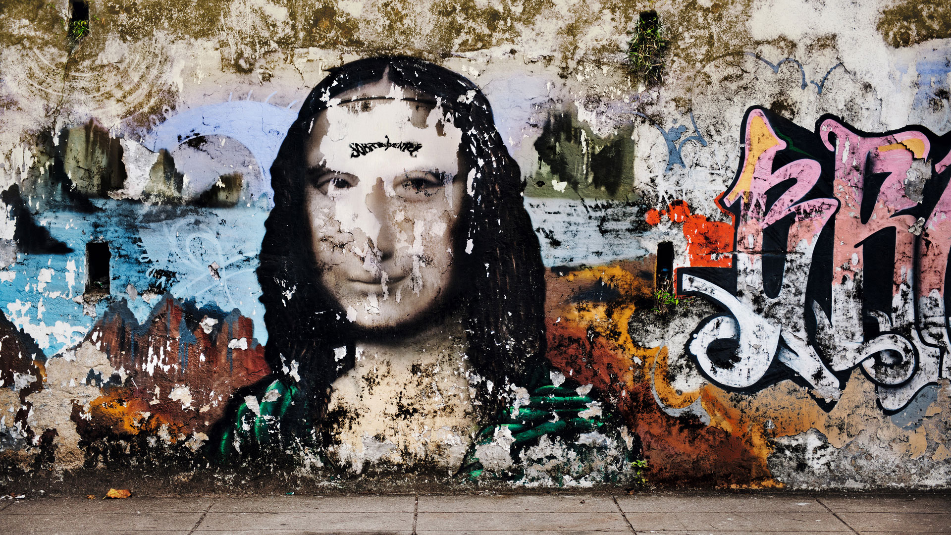 Muro com grafite de Monalisa tamb&eacute;m comp&otilde;e o trabalho<br>
