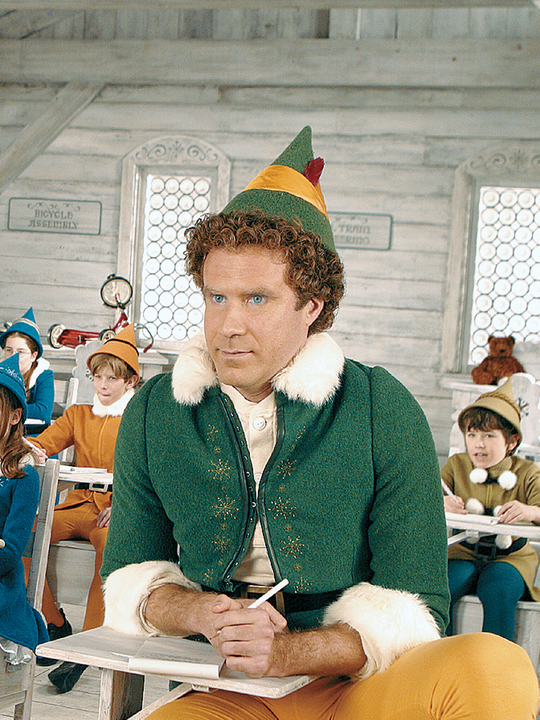 Um Duende em Nova York Will Ferrel vestido como duende numa sala de aula com outras crianças