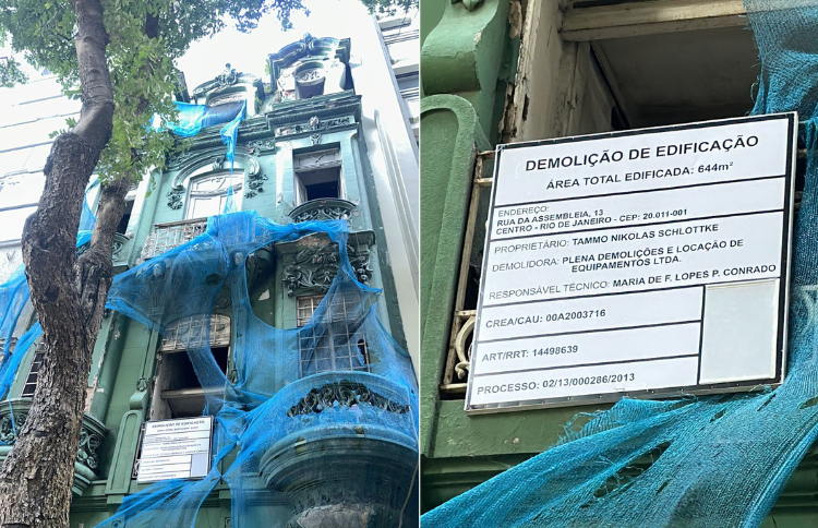 sobrado verde com placa de demolição