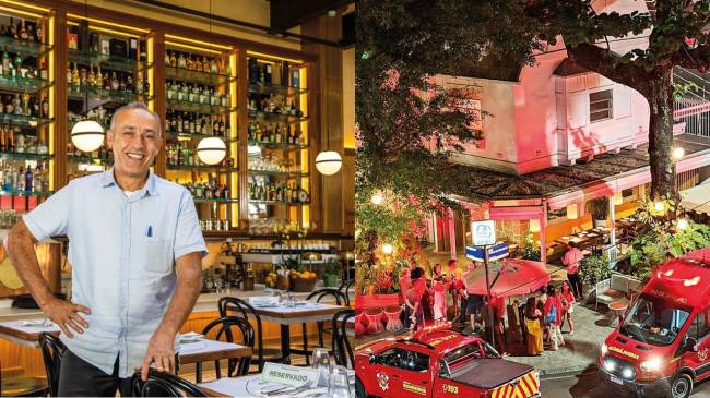 Homem sorridente de camisa azul clara em restaurante com prateleiras de bebidas ao fundo e cena noturna de rua movimentada com carros de bombeiro e pessoas