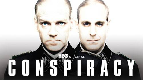 Dois homens brancos, um com olhar s&eacute;rio e outro com leve sorriso, vestindo uniformes militares escuros com ins&iacute;gnias, sobre fundo branco. O t&iacute;tulo CONSPIRACY em letras brancas grandes aparece na parte inferior, e HBO ORIGINAL acima